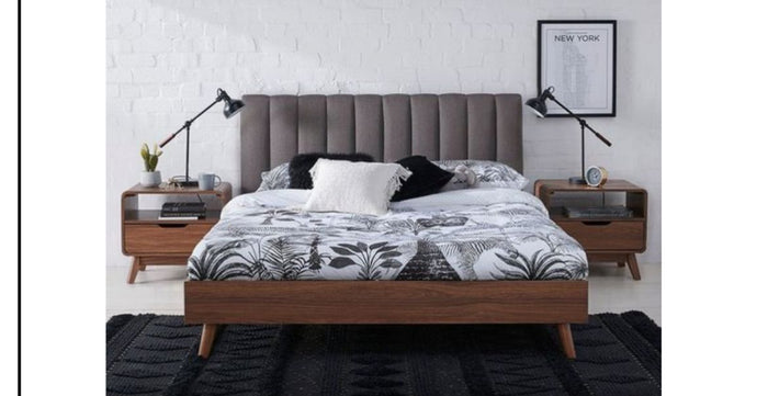 Modern solid wooden bed with upholstered headboard and matching bedside tables