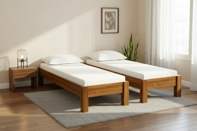 Two Acacia wooden single beds arranged in a twin bedroom setting
