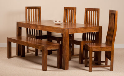 A 5-piece wooden dining set including a rectangular table, a bench, and four matching slatted chairs, shown in a warm medium brown finish against a neutral beige background.