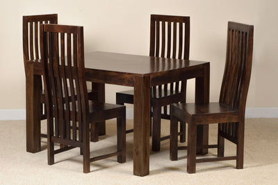 A 5-piece dark brown wooden dining set consisting of a rectangular table and four matching slatted-back chairs, shown against a neutral beige wall and carpet.