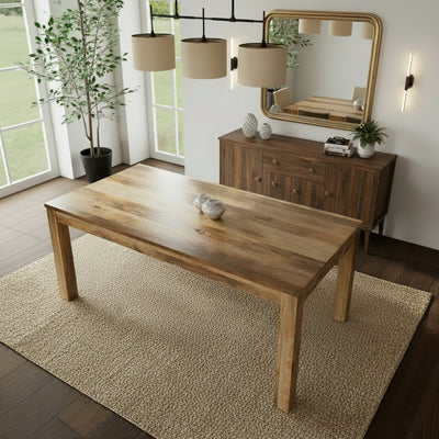 Wooden table in a room with a plant and window
