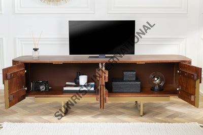 A mid-century modern wooden TV stand with open doors, styled with a television, books, and decorative items in a bright living room setting.