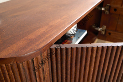 Close-up of a wooden desk with a ribbed panel design.