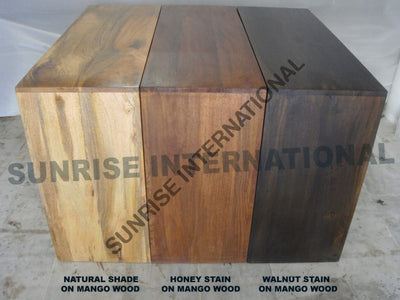 Wooden cube with natural, honey, and walnut stain options on a plain background.