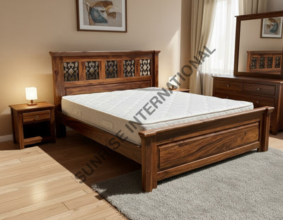 Sheesham wooden bed with artistic jali headboard in furnished bedroom setting