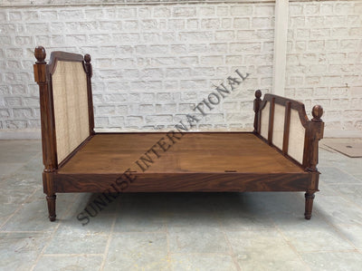 Sheesham wood rattan cane bed side view showing wooden frame and cane panels