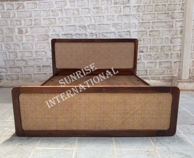 Sheesham wooden bed with rattan cane footboard and headboard, front view