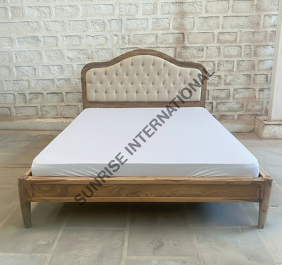 Sheesham wooden bed with padded tufted headboard shown with mattress