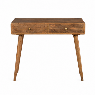 A mid-century modern wooden writing desk with two drawers, brass knobs, and tapered legs, shown on a solid white background.