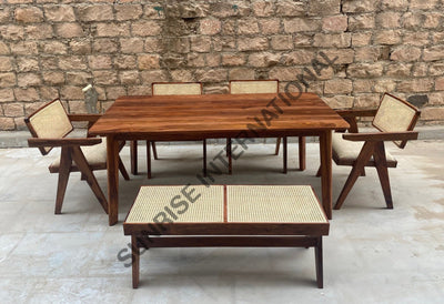Front view of Sheesham wood dining table set with rattan cane bench and chairs