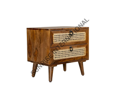 Angled view of Sheesham wood bedside cabinet with rattan cane drawer fronts