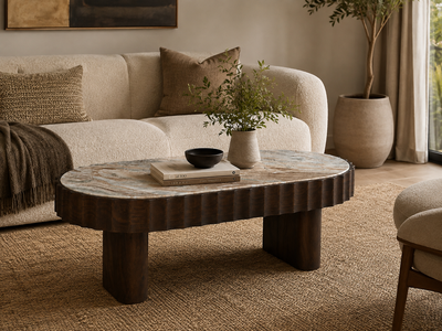 Solid wood coffee table with marble top in a modern living room