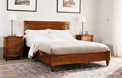 Solid Sheesham wood King size bed in a bedroom setting