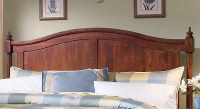 Solid Sheesham wood bed with paneled headboard and decorative wooden posts