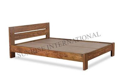 Solid Sheesham wood bed frame without mattress, angled view