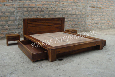 Wooden bed with open side storage drawers and matching bedside tables, angled view