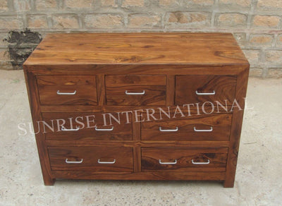 Front view of contemporary wooden 7 drawer cabinet with metal handles