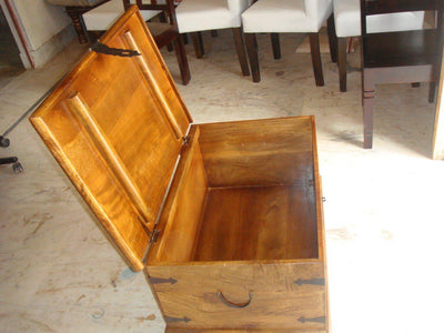 Rectangular wooden storage chest open to show internal storage space