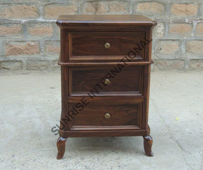 Angled view of Sheesham wood bedside cabinet with three drawers