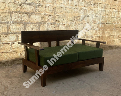 Contemporary Sheesham wood two seater sofa with green upholstered cushions