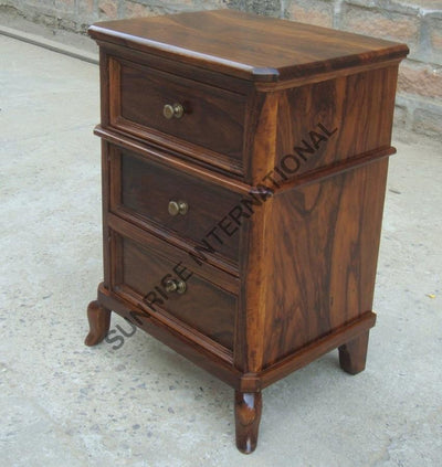 Wooden bedside table with all three storage drawers open