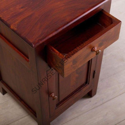 Wooden bedside table with top drawer open and lower cabinet door closed