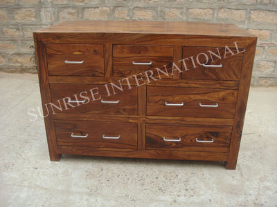 Straight front view of wooden chest of 7 drawers with metal bar handles